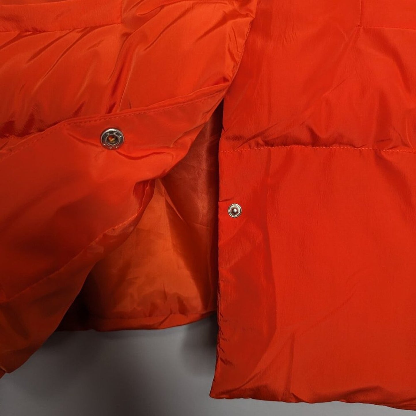 Bucket List Bright Orange Puffer Vest Ruffle Sleeve Pockets Snap Up High Collar